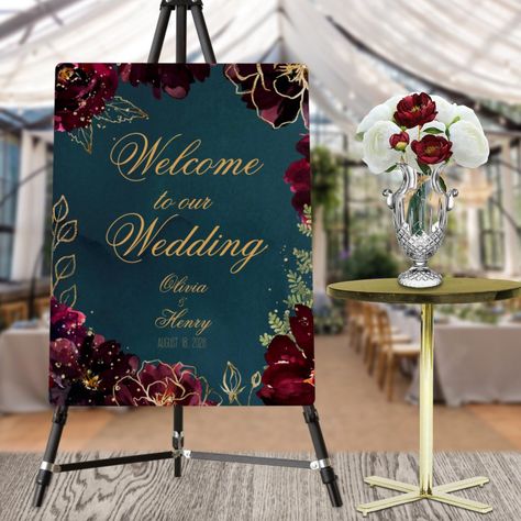 A teal blue jewel tone "Welcome To Our Wedding," wedding foam core poster sign featuring a symphony of deep bordeaux raspberry red peonies embellished with gold spray and shimmering gold outlines gather around a deep teal blue watercolor-wash background with your names in a rustic lively gold wedding script. Jewel Tone Wedding Decor, Jewel Tone Wedding Theme, Jewel Tone Decor, Raspberry Wedding, Purple And Gold Wedding, Wedding Script, Maroon Wedding, Jewel Tone Wedding, Jewel Tone Colors