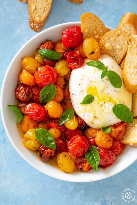 You'll love this easy to make Roasted Tomatoes and Burrata appetizer (or side dish). Made with juicy tomatoes that have been oven roasted with garlic and spices, creamy burrata cheese and topped with fresh basil. Grab some crusty bread for dipping and you are all set! #caprese #roastedtomatoes #burrata Burrata Appetizer, Tomatoes And Burrata, Tomatoes Burrata, Bread For Dipping, Caprese Appetizer, Oven Roasted Tomatoes, Baguette Bread, Parmesan Crisps, Burrata Cheese