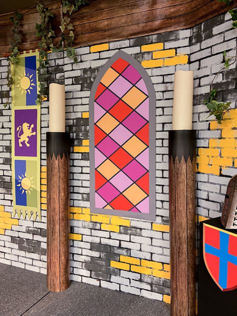 Layer stained glass painted cardboard on brick wall paper and add carpet tubes with pillar candles for a 3-D backdrop at Keepers of the Kingdom VBS Narnia Scenery, Kingdom Keepers Vbs Decorations, Keeper Of The Kingdom Vbs Decorations, Keepers Of The Kingdom Vbs Decorations, Kingdom Vbs Decorations, Kingdom Decorations, Kingdom Vbs Crafts, Keepers Of The Kingdom Vbs, Castle Theme Classroom