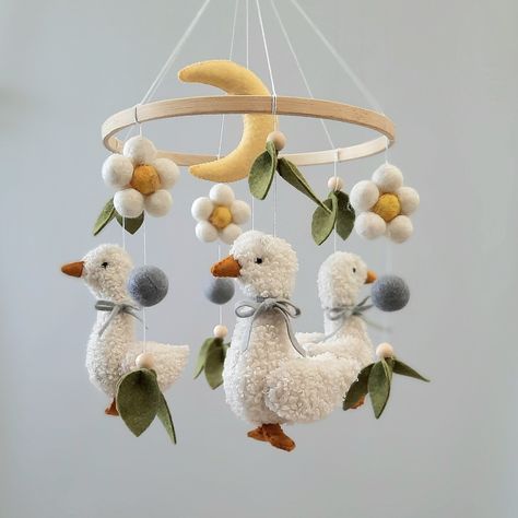 Mobile production time is 3-5 working days. Delivery within 3-4 weeks. Handmade crib mobile The height of the mobile phone from the top to the bottom is 17.7-18.9 inches (45-48 cm). Base diameter is 7.87 inches (20 cm). Materials: felt, holofiber, boucle fabric IMPORTANT! The crib holder and music unit are not included in the price of the mobile. The color of your mobile phone may differ slightly from what appears on your monitor. You can track your parcel using the track code, which you will re Mobile Over Crib, Farm Animal Mobile, Newborn Diy Gifts, Goose Baby Nursery, Compactum Nursery, Duck Theme Nursery, Goose Mobile, Felted Mobile, Frog Nursery