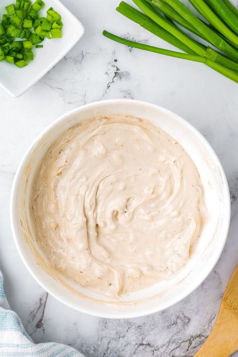 This easy homemade French Onion Dip recipe is made with the classic packet of onion soup mix, along with a blend of sour cream, mayo, garlic, green onions, and onion powder.Bring it to your next potluck, or enjoy it on a weekend with a bag of rippled potato chips. Stick Of Butter Rice, French Onion Dip Recipe, Homemade French Onion Dip, Onion Dip Recipe, French Onion Dip, Sliced Baguette, Onion Dip, Sour Cream And Onion, Soup Mixes