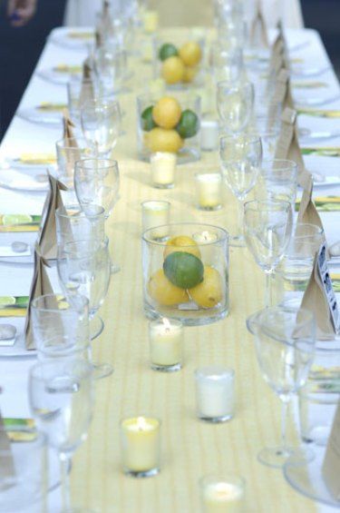 close up of backyard wedding reception table including yellow table runner and lemon lime centerpieces Lime Centerpiece, Yellow Wedding Centerpieces, Lemons Wedding, Non Floral Centerpieces, Fruit Centerpieces, Arrangement Ideas, Inexpensive Wedding, Table Arrangement, Centerpiece Ideas