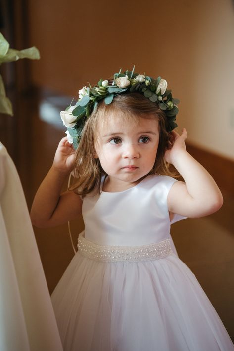 A flower girl wears a flower crown for wine country wedding. Flower Girl Wreath Floral Crowns, Flower Crown Flowergirl, Half Flower Crown, Flower Girls Flower Crown, Flower Crown Flower Girl, Flower Girl Crown Wedding, Flower Crown Wedding Flower Girl, Flower Girl Hairstyles With Flower Crown, Flower Girl Flower Crown