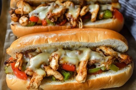 Oh boy, do I have a treat for you today! Let me take you on a mouth-watering journey with my favorite Chicken Philly Cheesesteak recipe. This sandwich holds not just a place in my stomach, but in my heart, too! I remember the first time I tasted a cheesesteak at a tiny deli downtown. The combination of juicy chicken, sautéed veggies, and melty cheese was more than just a meal; it was an experience! This Chicken Philly Cheesesteak is easy to whip up at home, and it brings that classic deli flav Homemade Chicken Philly Cheesesteak, Taco Bell Quesarito Recipe, Chicken Philly Cheesesteak Recipe, Quesarito Recipe, Philly Cheesesteak Recipe, Chicken Philly Cheesesteak, Xmas Cookies Recipes, Chicken Cheesesteak, Sautéed Veggies