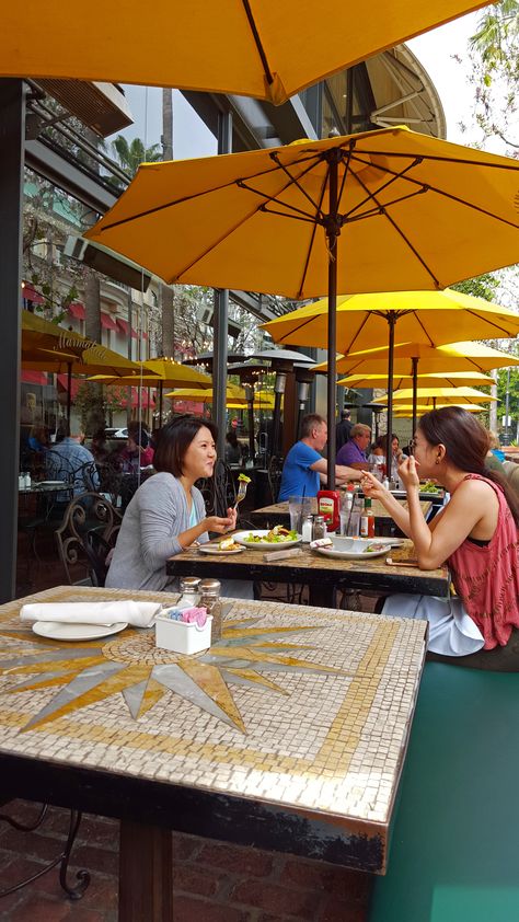 Marmalade Cafe's outdoor patio with yellow umbrellas Yellow Patio Umbrella, Cafe Umbrellas Outdoor, Cafe Umbrella, Large Outdoor Umbrella, Cafe Designs, Cool Umbrellas, Farm Cafe, Education City, Patio Pictures