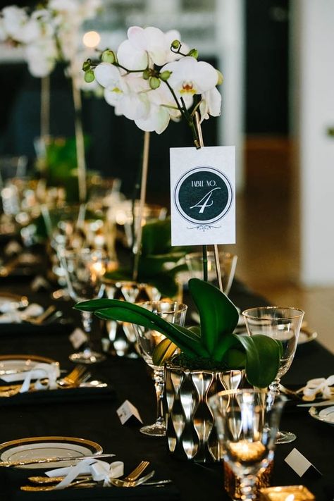 Black White and Gold Tablescape with Orchid Centerpieces Black And Gold Centerpieces, Gold Table Centerpieces, Orchid Centerpieces, Gold Centerpieces, Wedding Photo Gallery, Warehouse Wedding, Orchid Wedding, Gold Wedding Decorations, Black Christmas Trees