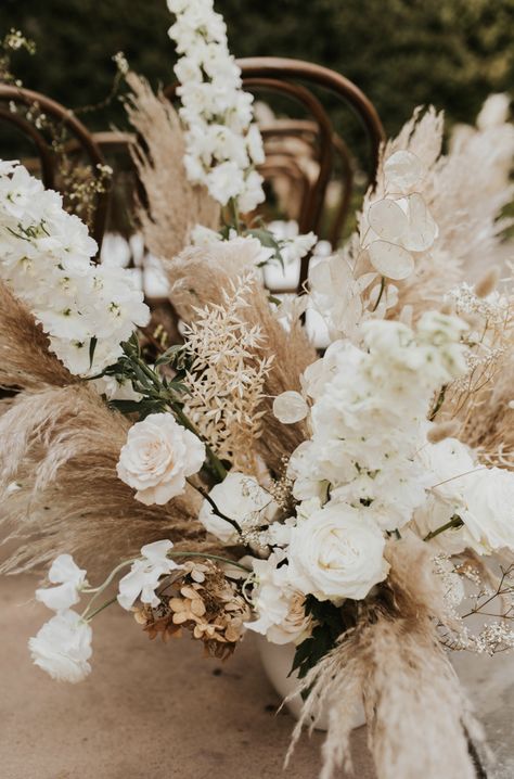 Beige Boho Bridal Bouquet, Neutral Boho Flowers, White Boho Flower Arrangements, White And Tan Floral Arrangements, White Boho Floral Arrangements, White Flowers And Pampas Wedding, Rustic Wedding Table Flowers, Spring Pampas Grass Wedding, Wedding Florals Neutral