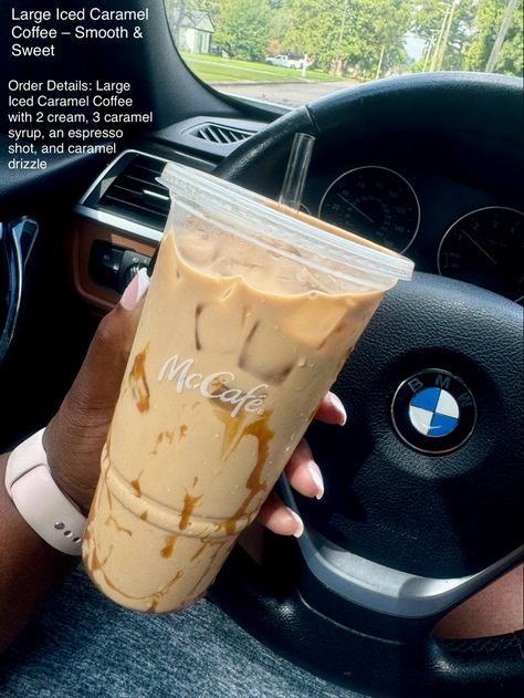 A hand holding a McCafé cup with iced coffee and extra caramel drizzle, in a car setting. Iced Coffee Mcdonalds Order, Mcdonald’s Ice Coffee, Mcdonald’s Drinks, Mcdonalds Coffee Order, Mcdonald’s Coffee, Mcdonalds Iced Coffee Order, Mccafe Iced Coffee, Mcdonalds Drink, Coffee Recommendations