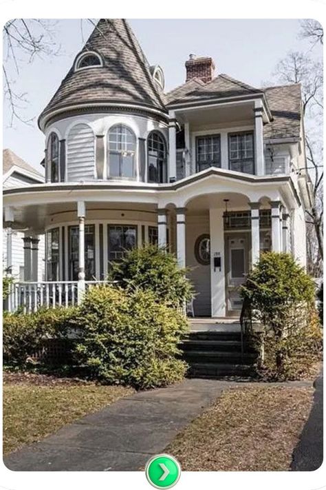 Elegant white Victorian with a tower room and wraparound porch blends intricate architectural details with a sleek modern twist, ideal for timeless living. New Build Victorian Homes, Remodeled Victorian Home, Victorian House Exterior, Small Victorian House, Victorian Home Exterior, Modern Victorian Home, Tower Room, Modern Victorian Homes, Victorian Homes Exterior