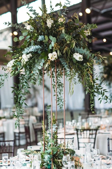 Wedding Flower Arrangements Greenery, Greenery Wedding Arrangements, Tall Centerpieces Wedding Table Decor, Industrial Boho Wedding Centerpieces, Tall Centerpieces Greenery, Heavy Greenery Centerpiece, Romantic Greenery Wedding Decor, Large Flower Arrangements Wedding Tall Centerpiece, Greenery Tall Centerpiece Wedding