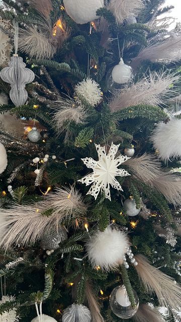 undisclosed ® on Instagram: "My all-white Christmas tree is up and I’m loving it! Added feathers for an extra kick this year. Ornaments by @westelm @cb2 @crateandbarrel @christmaspalacedesigners" Feathers On Christmas Tree, Christmas Tree With Feathers, White Feather Christmas Tree, Feather Christmas Tree Topper, Feather Christmas Tree, Christmas Tree Feather Garland, Christmas Tree Ostrich Feathers, White Feather Garland Christmas Tree, Christmas Tree Feathers