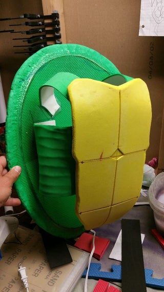 Picture of Assembly How To Make Ninja Turtle Costume, Teenage Mutant Ninja Turtles Cosplay, Ninja Turtles Halloween Costumes, Homemade Ninja Turtle Costume, Turtle Shell Costume Diy, Kids Ninja Turtle Costume, Diy Ninja Turtle Shell, How To Make A Teenage Mutant Ninja Turtle Shell, Teenage Mutant Ninja Turtles Halloween