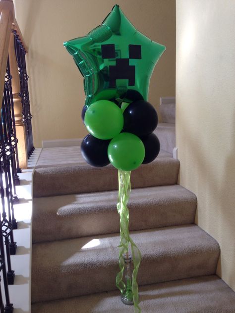 MINECRAFT BALLOON by Jingstyle I bought the Mylar star balloon at dollar tree. The green and black latex balloon and dowell at Walmart. Add the minecraft image cut from card stock and ribbons. There you go a nice centerpiece or welcome balloon for your party. Dollar Tree Minecraft Ideas, Minecraft Centerpiece Ideas, Balloon Minecraft, Minecraft Balloons, Minecraft Birthday Decorations, Minecraft Party Games, Minecraft Bday, Minecraft Party Decorations, Minecraft Birthday Cake