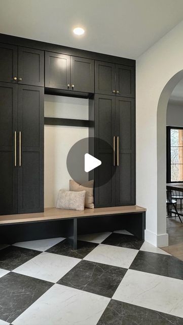 Jenna | Custom Home Build on Instagram: "This is your sign to do a moody mudroom and powder bath! This space was one of the most fun to design with the high contrast paint colors paired with natural wood tones, bold but timeless checkered floor pattern, and gold accents that pop 🖤⚡️  Sources: Mudroom cabinet paint: @sherwinwilliams Iron Ore Checkered tiles: @emsertile Mudroom cabinet hardware: @topknobs Iron door: @pinkysirondoors Bathroom paint: Iron Ore ceiling, walls, and trim Bathroom vanity: @homedepot Bathroom faucet: Amazon Sconces: @visualcomfort Mirror: Wayfair Soap dispenser: @thepolishedjar  For a direct link to shop these sources make sure you’re following @ourmidwayhome and comment “links” 🖤  #mudroomdesign #powderbath #boldpaint #moodyspaces #neutralhome #checkeredfloor #ho Mudroom With Black Tile Floor, Bathroom Vanity Iron Ore, Mudroom Cabinet Colors, Amazon Sconces, Iron Ore Bathroom Cabinets, Paint Iron Ore, Homedepot Bathroom, Iron Ore Ceiling, Moody Mudroom