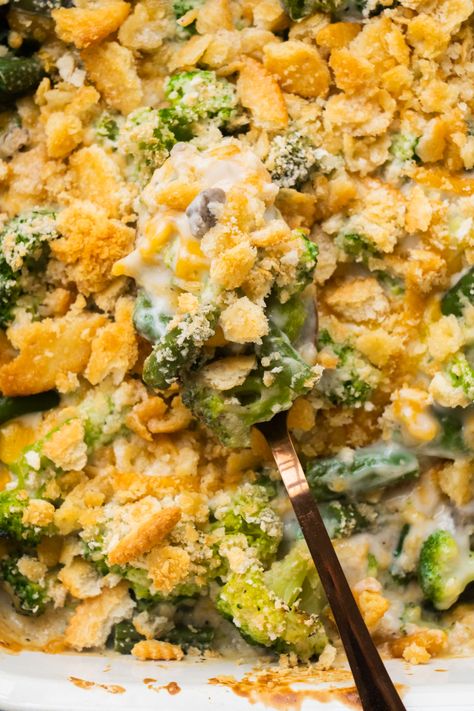 This comforting Green Bean Broccoli Casserole (With Frozen Vegetables) comes together quickly with the help of frozen vegetables, canned mushroom soup, cheddar cheese, and crunchy Ritz crackers. It’s a delicious and creamy side dish you can enjoy for the holidays or weeknight dinners. Green Bean Casserole Frozen, Frozen Green Bean Recipes, Easy Broccoli Casserole, Best Green Bean Casserole, Slow Cooker Green Beans, Classic Green Bean Casserole, Green Bean Casserole Easy, Vegan Green Bean Casserole, Easy Green Beans