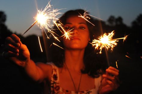 Girl with dark hair holding two sparkers and staring at the camera Pictures With Sparklers Night, Sparkler Photoshoot, Sparklers Photography, Firework Candles, Candle Photoshoot, Sparkler Photography, Creative Self Portraits, Night Shoot, Party Photoshoot