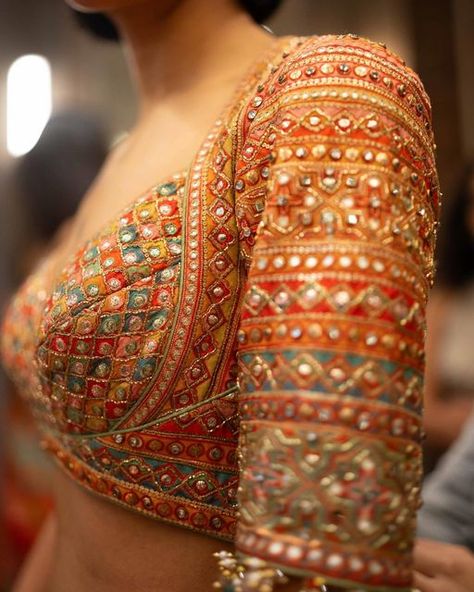 Tarun Tahiliani on Instagram: "𝗧𝗮𝗿𝘂𝗻 𝗧𝗮𝗵𝗶𝗹𝗶𝗮𝗻𝗶 | 𝗗𝗲𝘁𝗮𝗶𝗹𝘀  A closer look at the details of our Phulkari inspired pieces. The gota, mirror work and sequins weave a symphony of summer.   #TarunTahiliani #Craftsmanship #BTS #SOL #Bridalwear #TTBrides #TTBride" Choli Blouse Design, Best Indian Wedding Dresses, Blouse Design Images, Saree Blouse Patterns, Unique Blouse Designs, Designer Saree Blouse Patterns, Tarun Tahiliani, Indian Bridal Fashion, Blouse Hand Designs