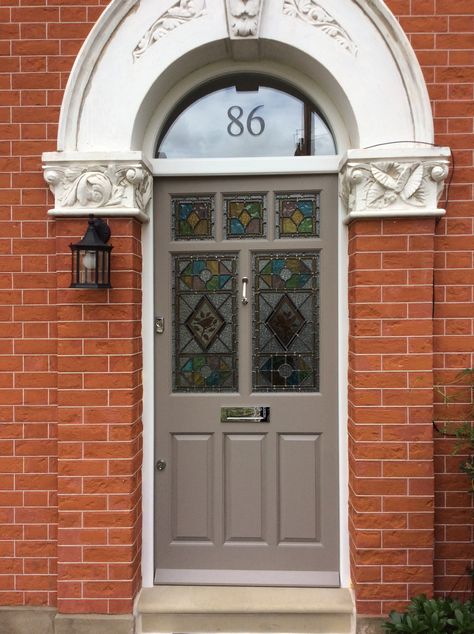 A stylish Edwardian front door in fantastic mushroom paint finish with decorative glass panelling  and polished chrome door furniture. Edwardian Architecture, Victorian Front Doors, Victorian Exterior, Traditional Front Doors, Victorian Door, Modern Front Door, Porch Doors, Edwardian House, Door Company