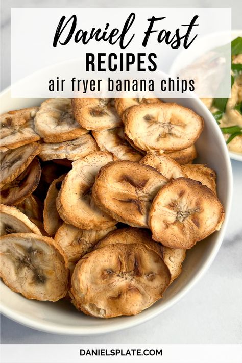 Are you doing the Daniel Fast? These savory air fryer banana chips are made with unripe green bananas. Pair this fast and easy one-ingredient snack with hummus or a big bowl of veggie chili. This chip is oil-free, soy-free, nut-free, gluten-free, vegan, and low-fat. Check out this and other Daniel Fast recipes here... How To Dehydrate Bananas, Air Fryer Banana Chips, Dehydrate Bananas, Air Fryer Sandwiches, Daniel Fast Snacks, Ninja Foodi Air Fryer Recipes, Daniel Fast Recipe, Dehydrated Banana Chips, Homemade Banana Chips