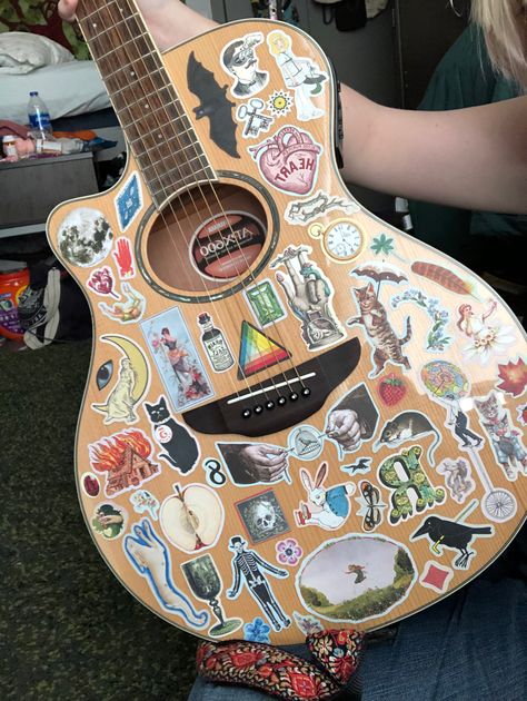 guitar decoration ideas Acoustic Guitar Decoration, Guitar With Stickers Aesthetic, Guitars With Stickers, Guitar Stickers Aesthetic, Guitar Stickers Ideas, Electric Guitars Aesthetic, Acoustic Guitar Stickers, Decorate Guitar, Guitar Decor Ideas