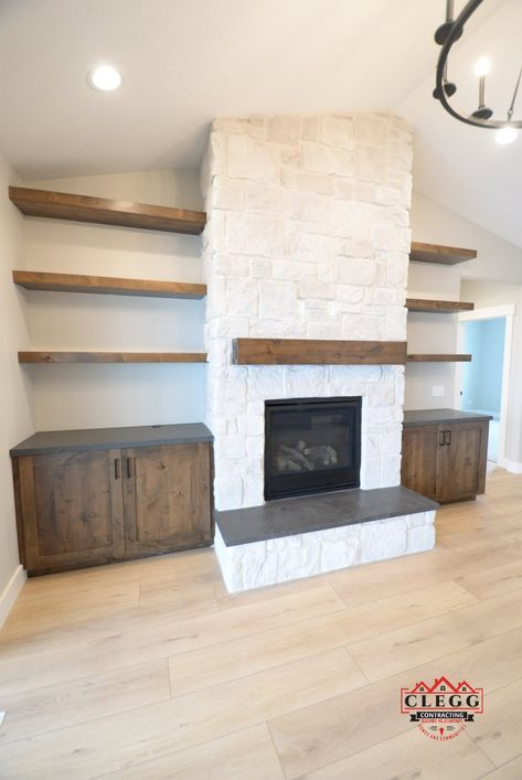 Stone Fireplace Makeover With Built Ins, Fireplace With Shelving On One Side, Stone Fireplace Shelves, Wood Stain Built In, Built Ins Around Brick Fireplace, Rock Fireplace With Built Ins, Stone Wall With Floating Shelves, Stone Fireplace With Floating Shelves, Stone Fireplace Built Ins