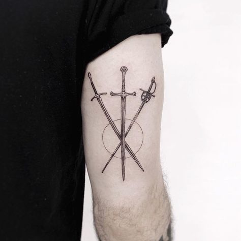 Micro tattoo of three swords. Black and grey, detailed, fineline, microrealism tattoo. Three Of Swords Tattoo Fine Line, Rapier Tattoo, 3 Swords Tattoo, Three Swords Tattoo Design, Three Swords Tattoo, Crossed Swords Tattoo, Three Of Swords Tattoo, Dean Tattoo, Swords Tattoo