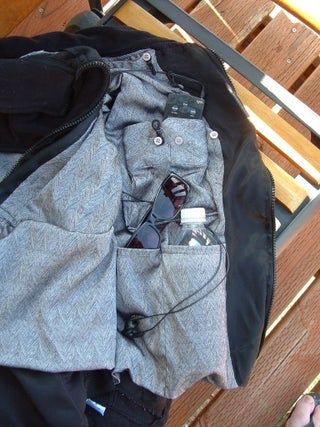 Spy Vest: 4 Steps (with Pictures) Diy Vest, Altered T Shirts, Altered Clothes, Travel Vest, Sewing Pockets, Silver Shirt, Pocket Vest, Travel Jacket, Adaptive Clothing