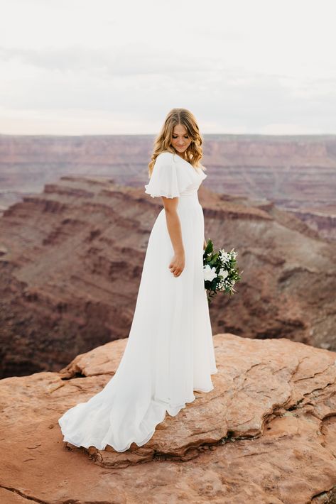 Nicole Aston Photo, Provo City Center Temple Bridals, bridal pose inspo, Dead Horse Point bridals, Moab wedding, Moab elopement, LDS bridals, wedding dress inspo, adventurous wedding Modest Wedding Dress Simple, Wedding Dresses Simple And Modest, Wedding Dresses Modest Plus Size, Cream Colored Wedding Dress Simple, Summer Country Wedding Ideas, Temple Worthy Wedding Dresses, Modern Lds Wedding Dress, Beach Wedding Dress Modest, Modest Wedding Dress With Sleeves