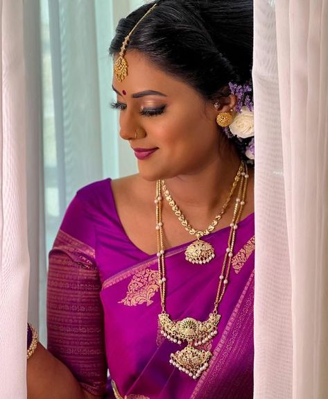 👑 T H I V A | Makeup Artist on Instagram: "My ever so beautiful Thanu on her wedding day ❤️ She went for the traditional pathakkam jewellery for her first look and it went perfect with her beautiful purple saree 😍 Bride @_shny.t Saree @rahjamdesignersilks Henna @henna_official.ss Lashes @thivabeauty Blouse @mayilcouture" Purple Saree Bride, Indian Hairstyles For Saree, Saree Bride, Purple Saree, Bridal Poses, Hindu Wedding, Bangle Designs, Classic Gold, Indian Hairstyles