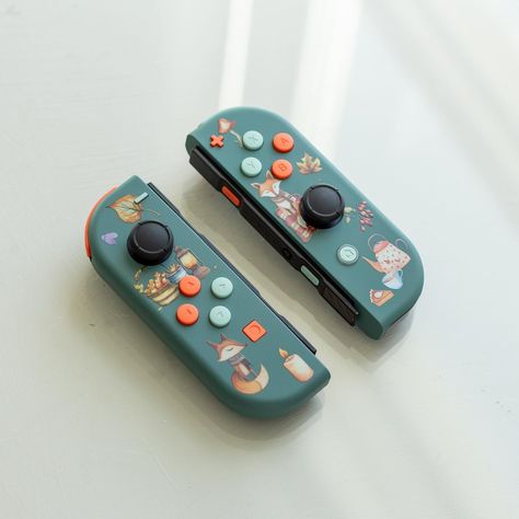 A new cozy look for your Nintendo Switch: Cozy Autumn Joy-Cons. #nintendoswitch #joycons #cozy #cozyhome #cozyhomedecor #autumn #autumnvibes #cozygaming #cozygamer #cozygamingcommunity #cozygamingsetup #foxes #fox Gamecube Controller, Original Nintendo, Xbox Controller, Nintendo Switch Games, Cozy Autumn, Cute Fox, Game Boy, Game Controller, Gaming Setup