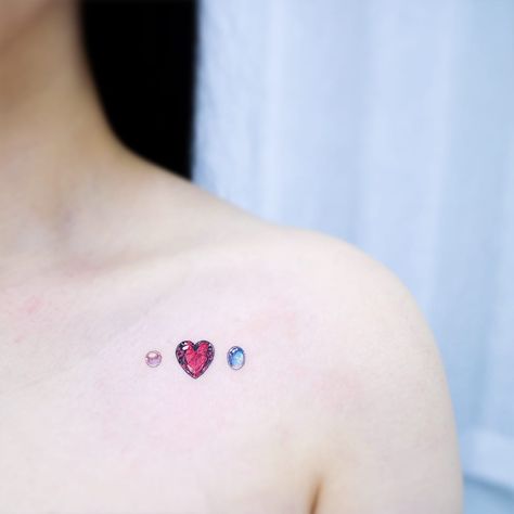 Tattoo by Heemee #Heemee #realismtattoos #hyperrealismtattoos #realism #hyperrealism #realistic #heart #gem #pearl #sapphire #moonstone #color #diamond #jewel Ruby Tattoo, Pearl Tattoo, Stone Tattoo, Gem Tattoo, Jewel Tattoo, Diamond Tattoos, Small Tattoos With Meaning, Small Tattoos Simple, Discreet Tattoos