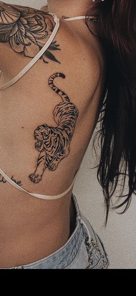 Tiger Tattoo On Knee, Tiger Tattoo Shoulder For Women, Tiger Tattoo On Rib Cage, Women’s Tiger Tattoo, Tiger Tattoo Forearm Women, Dainty Tiger Tattoo For Women, Lioness Roaring Tattoo, Tigress Tattoo For Women, Jungle Tattoo Sleeve Women