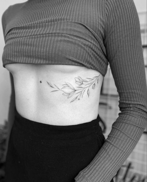 Leaves On Ribs Tattoo, Leaf Tattoo On Ribs, Botanical Rib Tattoo, Vine Ribcage Tattoo, Rib Floral Tattoo, Leaf Hip Tattoo, Minimalist Rib Tattoos For Women, Floral Rib Tattoos For Women, Olive Vine Tattoo