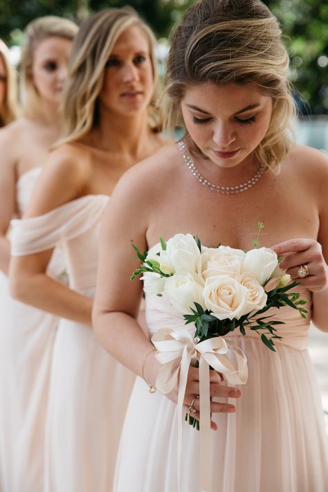 Bridesmaid holding small wedding bouquet posy style tied with ribbon Tulip Bridesmaid Bouquet, Wedding Flowers White Roses, Small Wedding Bouquets, Bridesmaid Bouquet White, White Rose Bouquet, White Bridesmaid, Wedding Inside, White Wedding Bouquets, White Wedding Flowers