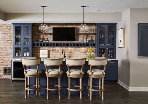 This basement bar gives a pop of blue color to the room, offering plenty of cabinet storage and a comfortable island bar for guest seating. Best Neutral Paint Colors, Basement Lighting, Basement Bar Designs, Basement Kitchen, Small Basements, Waterproofing Basement, Home Bar Designs, Basement Bedrooms, Blue Cabinets