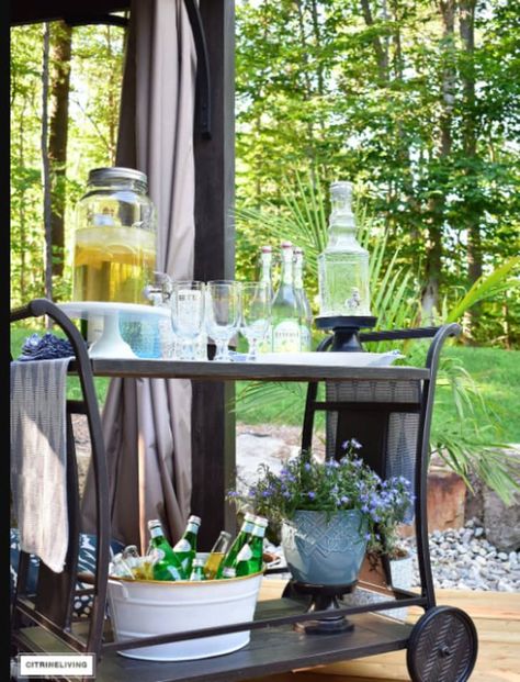 8 Outdoor Bar Carts That'll Make Your Porch or Patio the Ultimate Hangout | Apartment Therapy Outdoor Bar Cart Decor, Serving Cart Decor Ideas, Outdoor Serving Cart, Outdoor Bar Ideas, Rattan Bar Cart, Metal Bar Cart, Gold Bar Cart, Outside Bars, Bar Outdoor