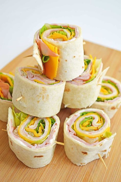 These Ham and Cheese Pinwheels, or ham roll-ups, are a kid-friendly appetizer perfect for game days, picnics and more. They can even double as a leisurely lunch for the kiddos too! I might also have a few for breakfast from time to time because they are so delicious! I can't wait to tell you all about my favorite pinwheel recipes. As you know, we're all about easy at my house. Easy breakfast, easy lunch, easy dinner. The less clean-up, the better. But, I also like to host and entertain and we Sweet Potato Hummus Recipe, Kid Friendly Appetizers, Trisha's Southern Kitchen, Potato Hummus, Trisha Yearwood Recipes, Ham And Cheese Pinwheels, Pinwheel Sandwiches, Sweet Potato Hummus, Pin Wheels