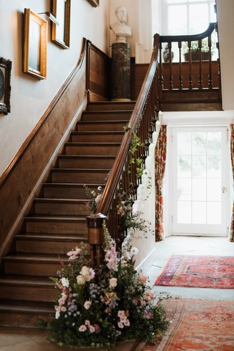 Greenery and pink flowers on staircase bannister for a wedding. Flower Garland Staircase, Staircase Wedding Flowers, Staircase Florals Wedding, Greenery On Staircase, Flowers On Staircase, Staircase Flowers Wedding, Staircase Greenery, Staircase Florals, Staircase Flowers