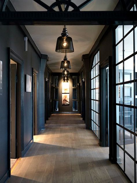 I love this hallway, the dark paint contrasted against the rustic wood floors, and the smoke glass pendants. Charcoal Walls, Rustic Wood Floors, Light Wood Floors, Dark Walls, Dark Interiors, Style At Home, Black Walls, Large Windows, Home Fashion