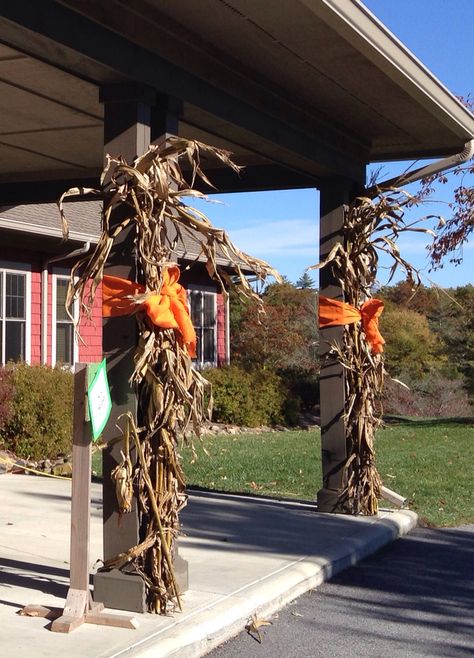 Tall corn stalks and orange burlap bows for fall columns Fall Corn Stalk Decor, Decorate With Corn Stalks, Dried Corn Stalks Front Porch, Corn Stalks Decorations Diy, Decorating With Corn Stalks, Fall Front Porch Decor Straw Bales, How To Attach Corn Stalks To Porch, Fall Decor With Straw Bales, Corn Stalks Front Porch