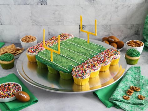 Football Stadium Pull Apart Cupcake Cake Recipe | Heather Baird | Food Network Football Party Cupcake Ideas, Sports Themed Cupcake Cake, Football Cake Recipe, Cupcake Football Cake, First Down Football Birthday Party Cake, Sports Cupcake Cake, Football Birthday Party Food Ideas, Football Birthday Cake Ideas, Football Themed Cupcakes