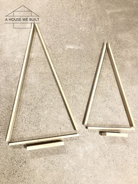 How to DIY a Modern Wooden Christmas Tree Wooden Xmas Trees Triangle, Triangle Wooden Christmas Trees, Wooden Shim Christmas Tree, Diy Triangle Christmas Tree, Black Wooden Christmas Tree, Wood Slat Christmas Tree Diy, Christmas Tree Made Out Of Shims, Triangle Tree Template, Diy Wood Christmas Tree Plans