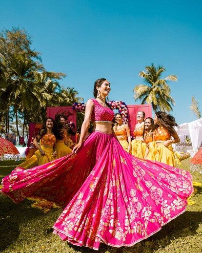 Magenta pink is one such classic color that never goes out of style !! #pink #mehndi #lehenga #bridal #indianbride #Indianweddings #modern #latest Fusia Pink Lehenga Bridal, Bright Pink Lehenga, Haldi Ceremony Pink Outfit, Pink Saree For Haldi, Pink Lehenga For Haldi, Pink Haldi Outfit For Bride, Pink Mehndi Outfit, Pink Haldi Outfit, Magenta Pink Lehenga