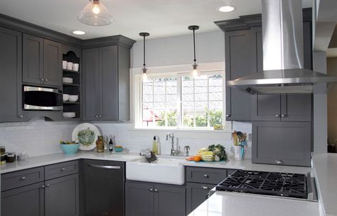 White and gray kitchen features gray shaker cabinets adorned with brushed nickel pulls alongside white quartz counters which pair with a mini subway tiled backsplash highlighted by dark gray grout. Description from decorpad.com. I searched for this on bing.com/images Dark Grey Cabinets, Grey Painted Kitchen, Dark Grey Kitchen Cabinets, Dark Gray Kitchen Cabinets, Серая Кухня, Grey Kitchen Designs, Dark Grey Kitchen, Painted Kitchen Cabinets Colors, Gray And White Kitchen