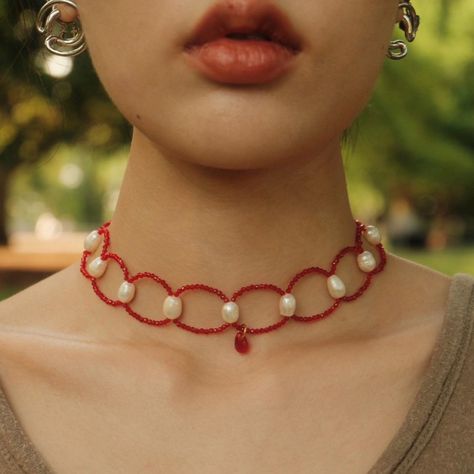 《Scarlet Crown》"This necklace is crafted with red 2mm glass beads, adorned with irregular pearls ranging from 6-8mm, and features a 9mm red teardrop-shaped glass pendant." Size：The necklace length is approximately 14 inches, and the ribbon length is 28 inches. ‼️ Important Information Before Purchase: Please note that all natural products (such as pearls, shells, crystals, etc.) come in varied shapes and may exhibit irregularities or natural cracks. No two necklaces or earrings are identical; kindly make your purchase with caution. 📿To ensure the longevity of your jewelry, please refrain from wearing them while bathing, swimming, in saunas, during physical activities, and avoid exposure to high temperatures or alcohol. Mexican Beaded Jewelry, Red Beaded Jewelry, Beaded Christmas Jewelry, Red Bead Necklace, Bead Necklace Designs, Beeded Necklace, Bead Cross Necklace, Bohemian Wedding Earrings, Red Beaded Necklace