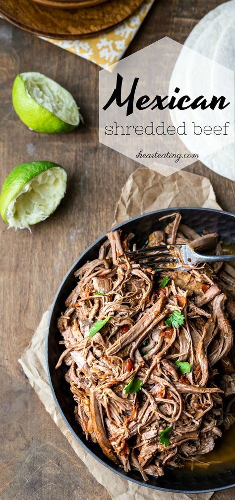 Take Taco Tuesdays up a notch with this tender Mexican Shredded Beef recipe that cooks in the crock pot! The flavorful sauce and juicy meat make a great filling for tacos, burritos, quesadillas, and more. Shredded Beef Recipe, Shredded Beef Recipes, Crispy Oven Fried Chicken, Shredded Beef Tacos, Mexican Shredded Beef, Skirt Steak Recipes, Authentic Mexican Recipes, Mexican Beef, Tacos Burritos