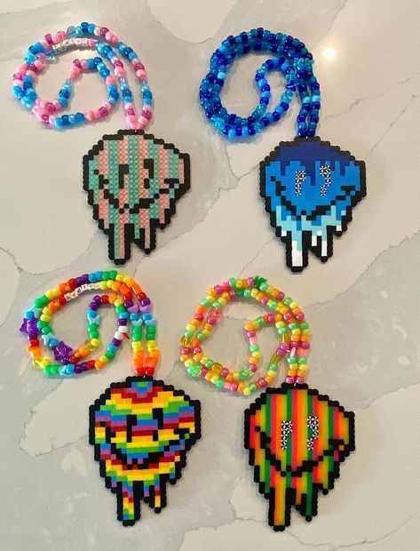 Handmade Custom Perler! This Trippy Smiley Face Perler is sure to turn heads!🌈 Choose between a color shown above or your own custom color! All Kandi is handmade in Florida and we do not make duplicates 🙂 We can also do custom Kandi/Perler Orders too! Message us to inquire☮️ If we don't have what you are looking for, we will shoot you a message to let you know! Shipping: ~Free shipping on orders over $35! ~Orders will ship within 2-3 business days. ~Tracking numbers will be added to your order Perler Necklace Ideas, Trippy Fuse Beads, Perler Ideas Rave, Perler Necklace Rave, Perler Bead Patterns Edm, Perler Beads Necklace, Perler Patterns Trippy, Electric Forest Perler, Rave Perler Pattern Trippy