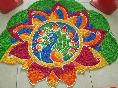 Peacock  Rice kolam Wedding Rangoli Designs, Rice Rangoli, Wedding Rangoli, Rangoli Photos, Tamil New Year, Indian Rangoli Designs, Peacock Rangoli, Latest Rangoli, Rangoli Colours