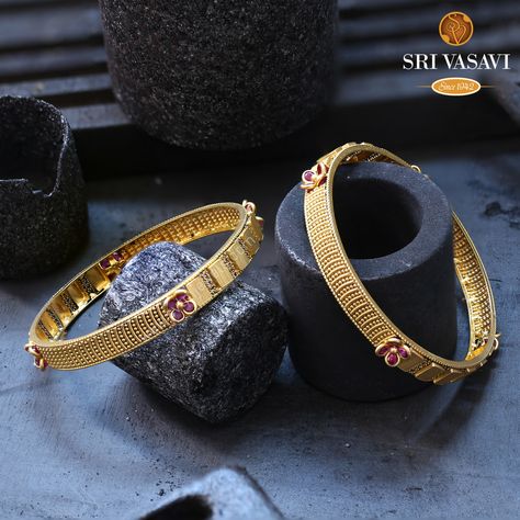 These fascinating, utterly contemporary gold and Fancy bangles are sure to capture the interest of your young one as soon as she sets her sights on them. the bangles feature a unique wavy, oval-shaped design and are studded with four sets of fiery red Stones, radiating charm and elegance. ... Stone Bangles Gold Designs, Stone Bangles Gold, Fancy Bangles, Bangle Ceremony, Indian Gold Jewellery Design, Antique Gold Bracelet, Small Earrings Gold, Indian Jewelry Earrings, Gold Bangles For Women