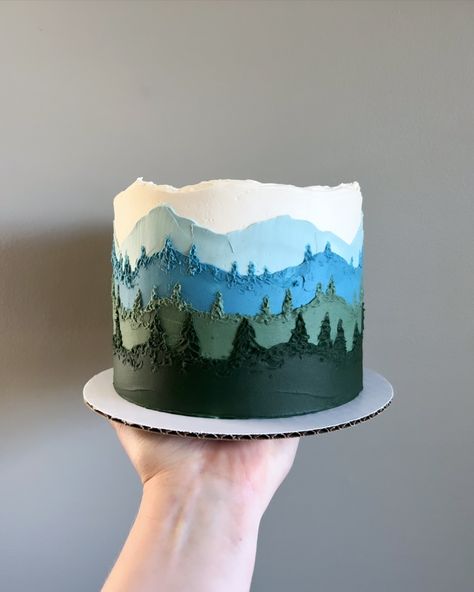 🤍🩵💙💚 • • Order mountain view cakes on our website 🔗 in bio! • • #Buttercreamcakes #buttercreamcake #buttercream #buttercreamart #customcake #cakedecorating #cakestagram #cakedesign #instacake #cakeideas #vermontbakery #vermontbaker #homebaker #homebakery #bakergram #vermont #madeinvermont #madeinvt #shelburnevermont #shelburnevt #bluehousebakeshop #cake #baker #pastrychef Smokey The Bear Cake, Buttercream Mountain Cake, Small Mountain Wedding Cake, Woodsy Cake Ideas, Hiking Cake Ideas, Nature Themed Cake, Hiking Cake, Woodsy Cake, Mountain Wedding Cake